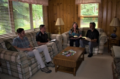 Four people enjoying a home Bible fellowship
