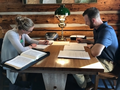 A couple studying the Word at a table